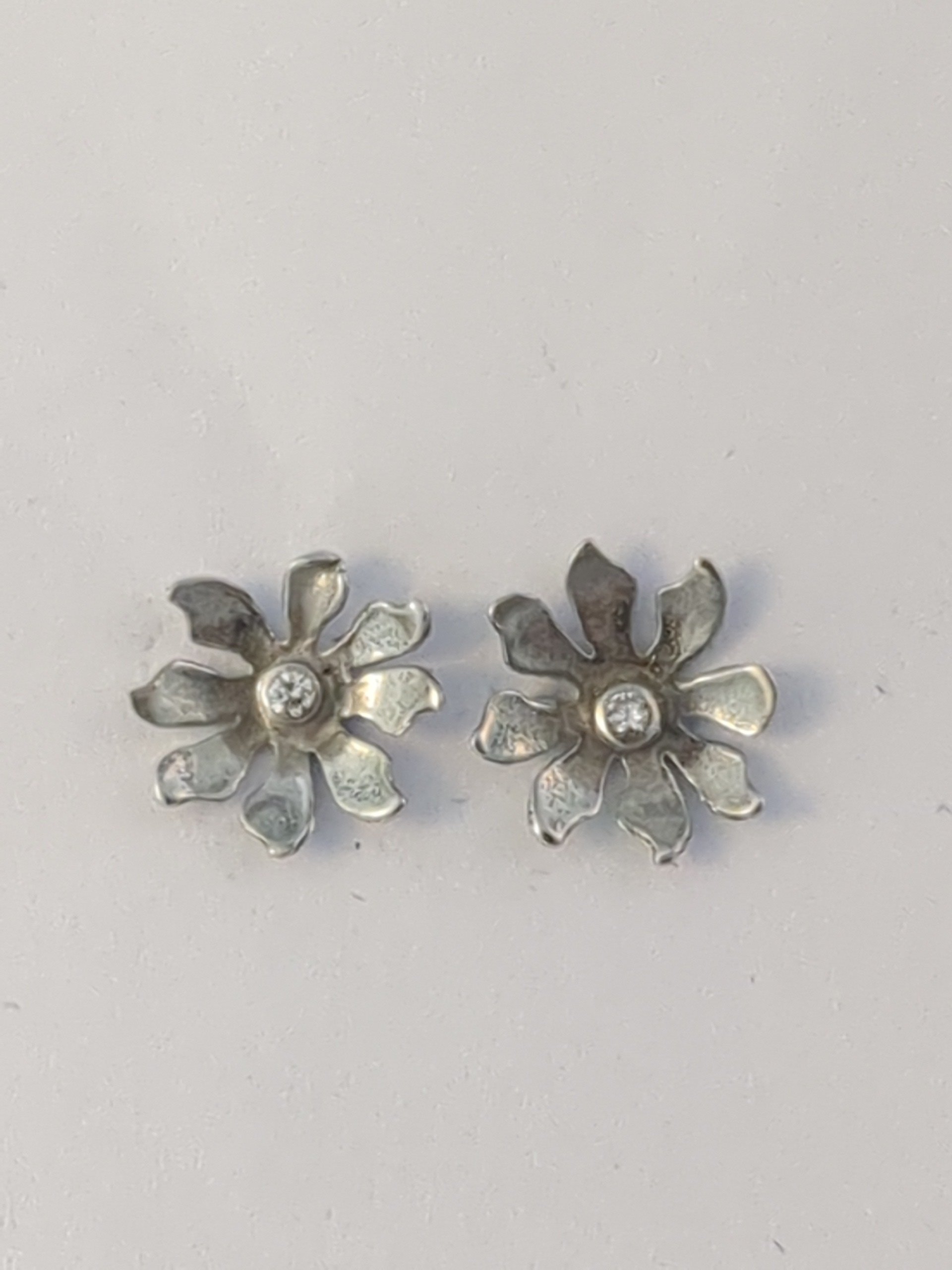 Silver diamond flower stud earrings