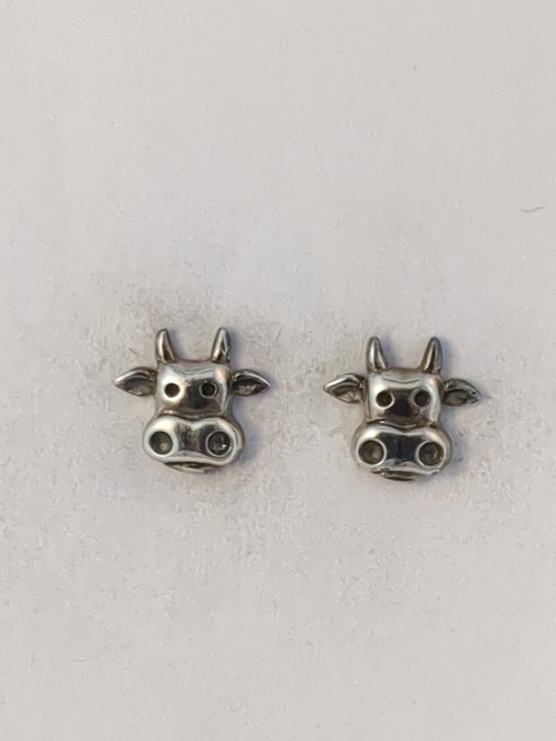 Silver cow stud earrings