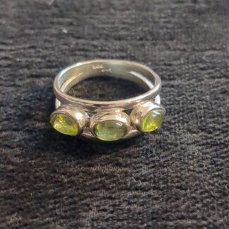Silver peridot three stone ring