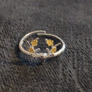silver deer with gold plated flowers