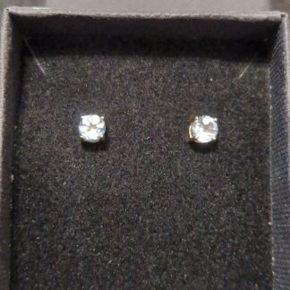 9ct Gold sky blue topaz studs